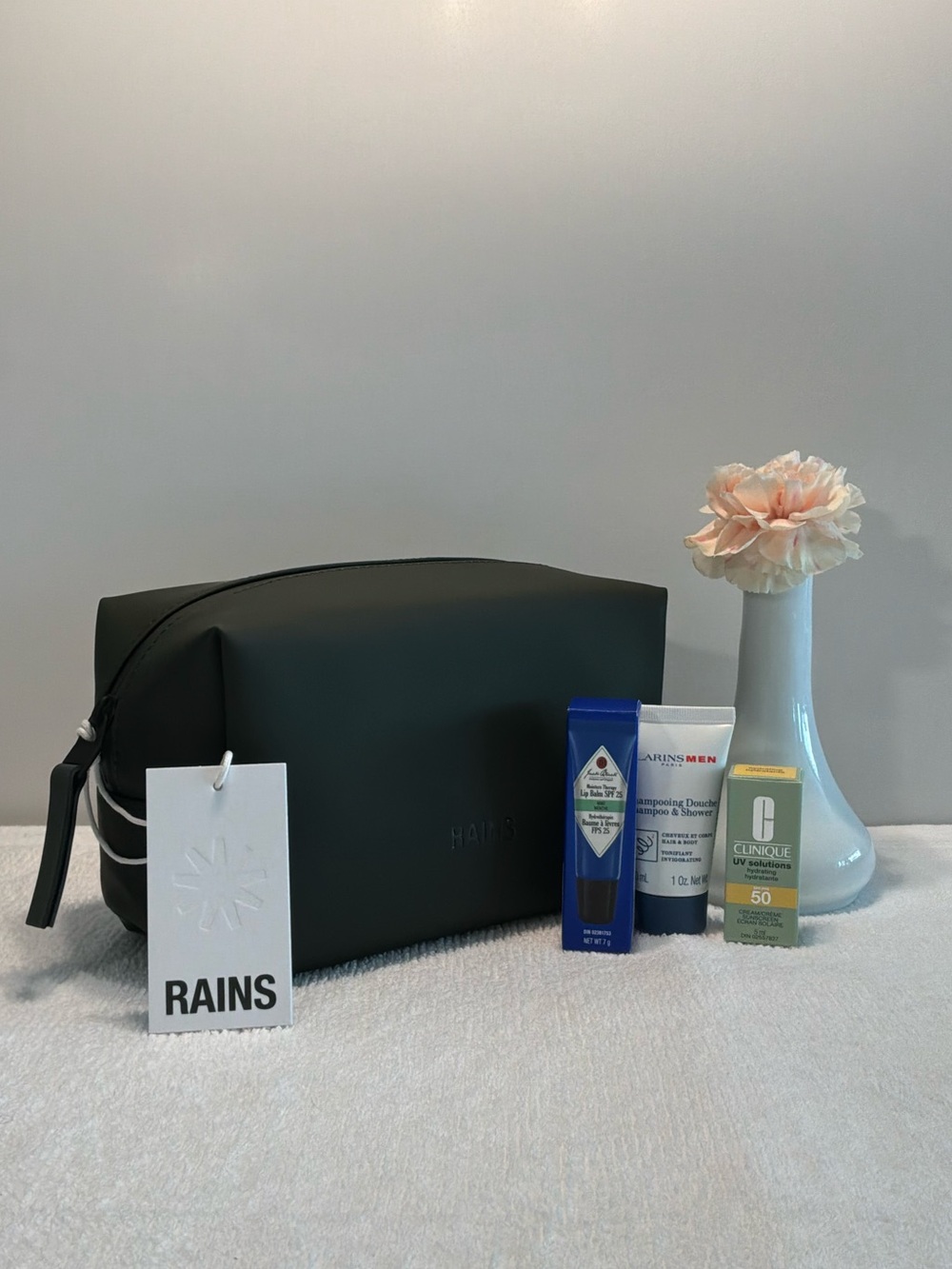 RAINS NEW green zippered toiletry bag with deluxe summer essentials